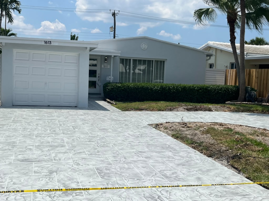 Stone-pattern stamped concrete driveway