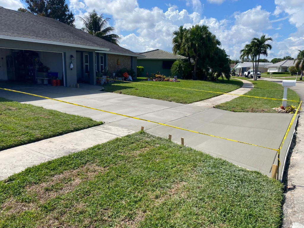 Concrete driveway apron extension to street